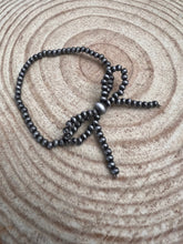 Load image into Gallery viewer, Faux Sterling Pearl Bow Stretch Bracelet